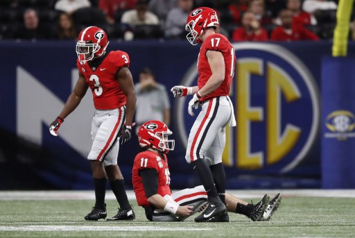 Jake From #11 of the Georgia Bulldogs is seen struggling with an injury. The Bulldogs will compete in the 2020 Sugar Bowl.