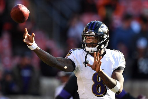 Lamar Jackson #8 of the Baltimore Ravens warms up prior to an NFL match. Jackson will lead the Ravens offense in their Tennessee Titans Vs. Baltimore Ravens AFC Divisional Round match.