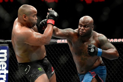 Daniel Cormier fights against Derrick Lewis in their heavyweight title bout during the UFC 230