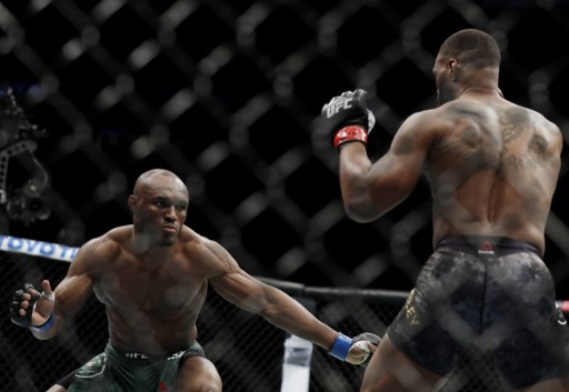Tyron Woodley (R) and Kamaru Usman, of Nigeria, fight during their welterweight title bout during UFC 235