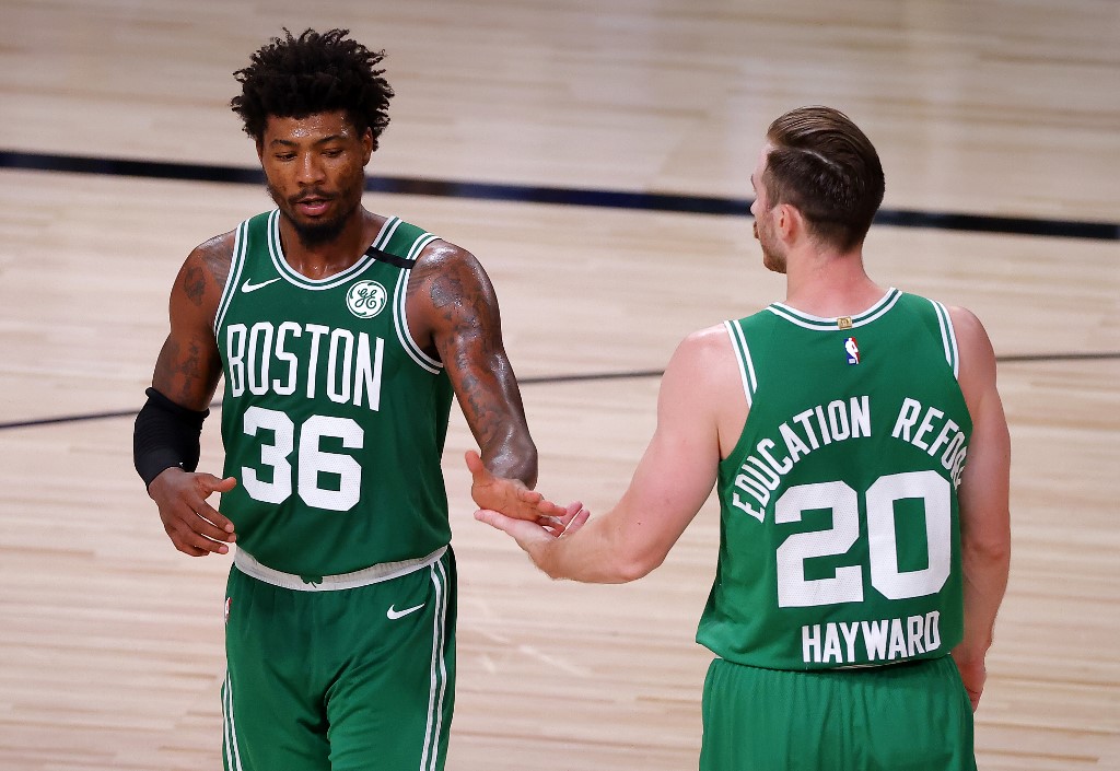 Marcus Smart and Gordon Hayward of the Boston Celtics react during the fourth quarter against the Miami Heat