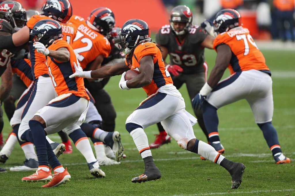 Running back Melvin Gordon of the Denver Broncos rushes against the Tampa Bay Buccaneers during the second half at Empower Field At Mile High