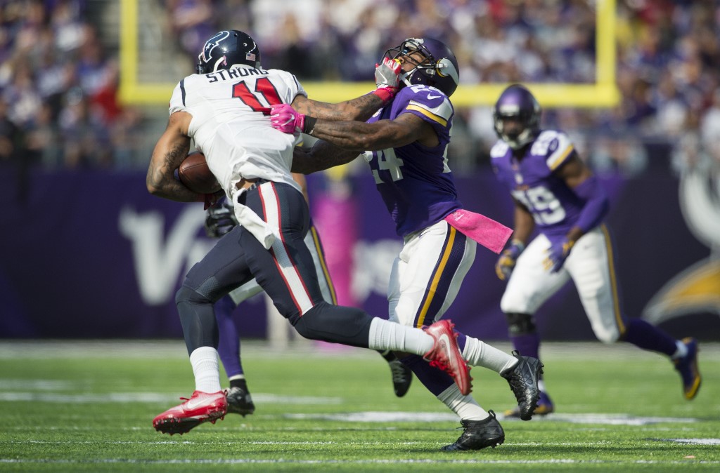 Jaelen Strong of the Houston Texans pushes off the face mask of Munnerlyn of the Minnesota Vikings -Vikings vs Texans Betting Odds
