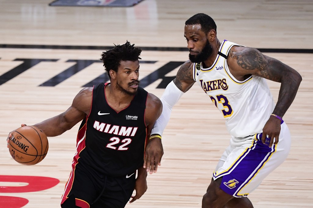 Jimmy Butler of the Miami Heat dribbles against LeBron James of the Los Angeles Lakers -Heat vs Lakers Game 4 Pick