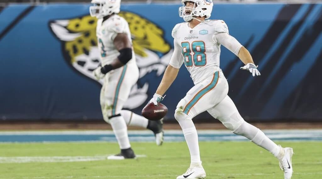 Mike Gesicki of the Miami Dolphins celebrates after scoring a touchdown during the second quarter of a game against the Jacksonville Jaguars