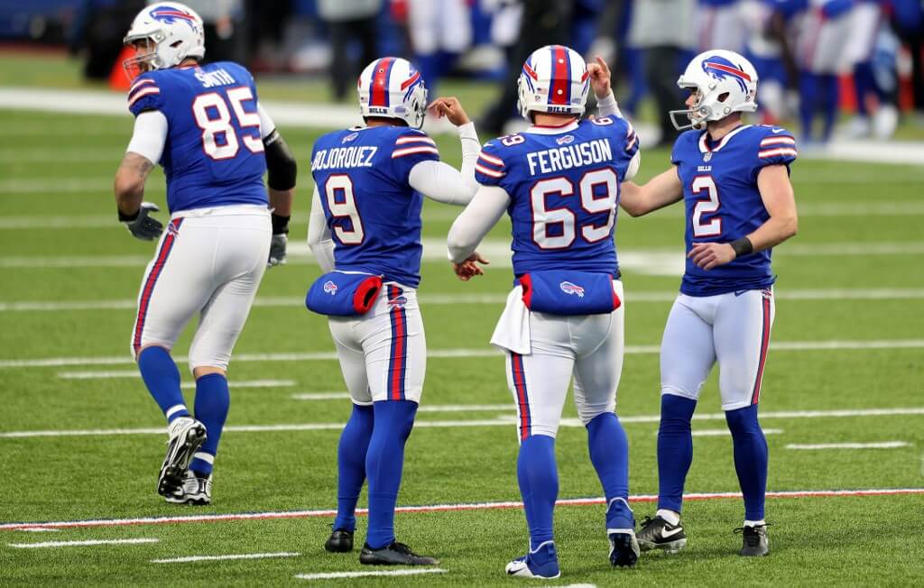 Tyler Bass of the Buffalo Bills celebrates a field goal during a game against the New England Patriots at Bills