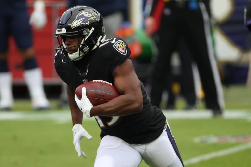 Wide receiver Devin Duvernay of the Ravens rushes against the Tennessee Titans during the first half at M&T Bank Stadium