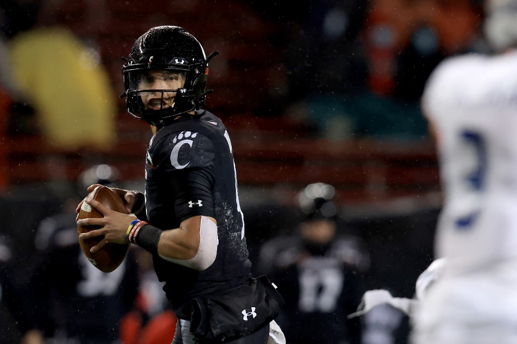Desmond Ridder of the Cincinnati Bearcats looks to pass the ball in game. Check out BetUS' Peach Bowl betting preview