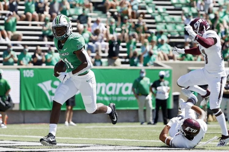 Xavier Gaines of the Marshall Thundering Herd runs into the end zone for a 22-yard touchdown in the first quarter