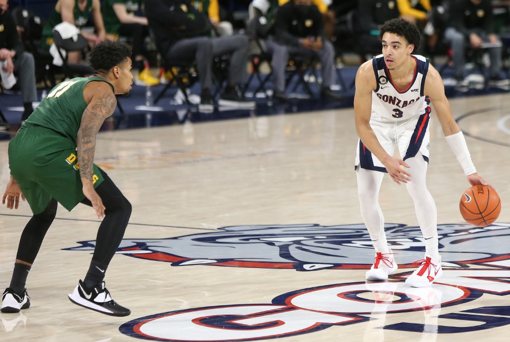 Andrew Nembhard of Gonzaga Bulldogs controls the ball against defender. Check out our top picks for 2021 NCAA Tournament Final Four betting