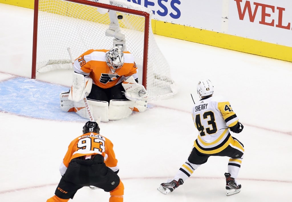 Conor Sheary of the Pittsburgh Penguins scores against Carter Hart of the Philadelphia Flyers. Check out the Flyers vs Penguins NHL picks