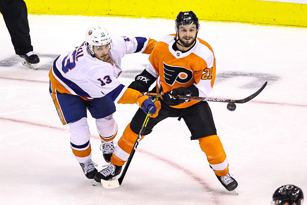 Mathew Barzal of New York Islanders & Scott Laughton of Philadelphia Flyers eye loose puck. Here's our Islanders vs Flyers betting preview