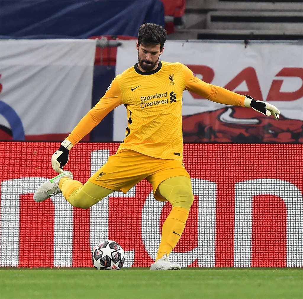Liverpool's Brazilian goalkeeper Alisson kicks the ball during match. Read our European Soccer Leagues betting preview