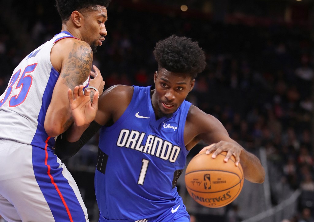 Jonathan Isaac #1 of the Orlando Magic drives around Christian Wood #35 of the Detroit Pistons. Read our Pistons vs Magic betting preview