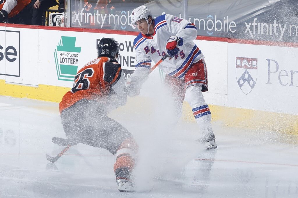 Ryan Strome of the Rangers looks to pass Flyers Rangers