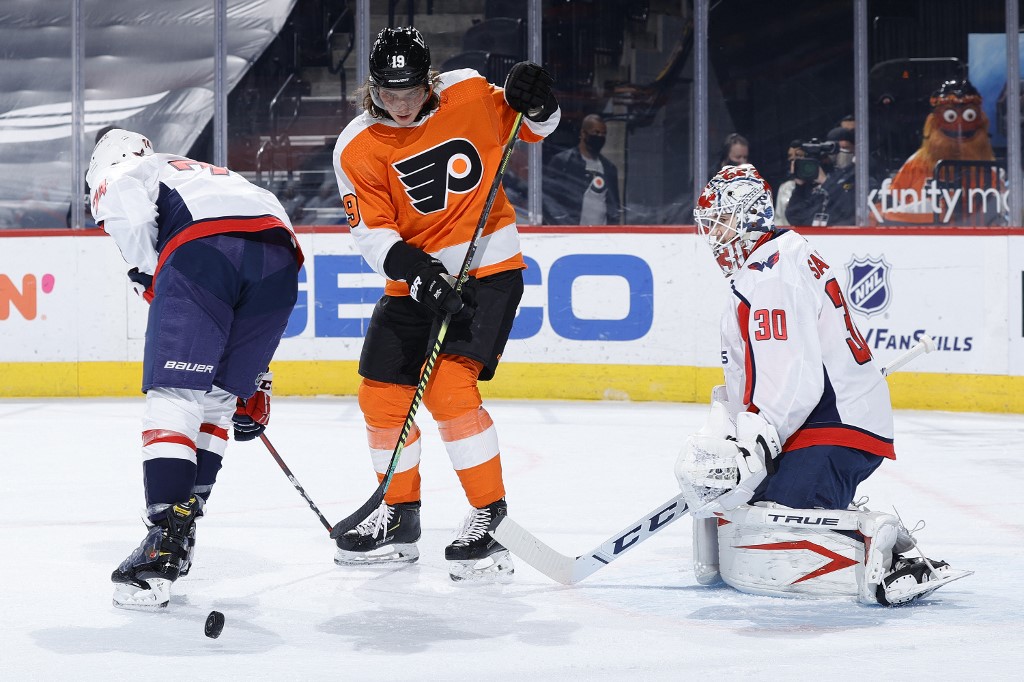 Nolan Patrick #19 of Philadelphia and Ilya Samsonov #30 of the Washington Capitals watch puck. Read our Capitals vs Flyers betting preview.