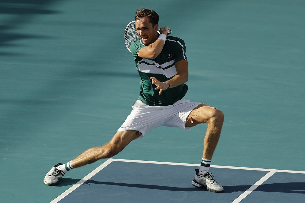 Daniil Medvedev of Russia returns a shot to Frances Tiafoe of the United States during the Miami Open