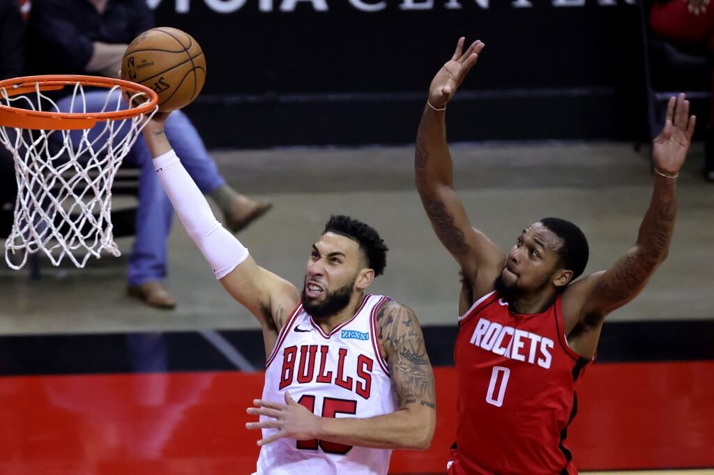 Denzel Valentine of the Chicago Bulls puts up a basket ahead of Sterling Brown of the Houston Rockets