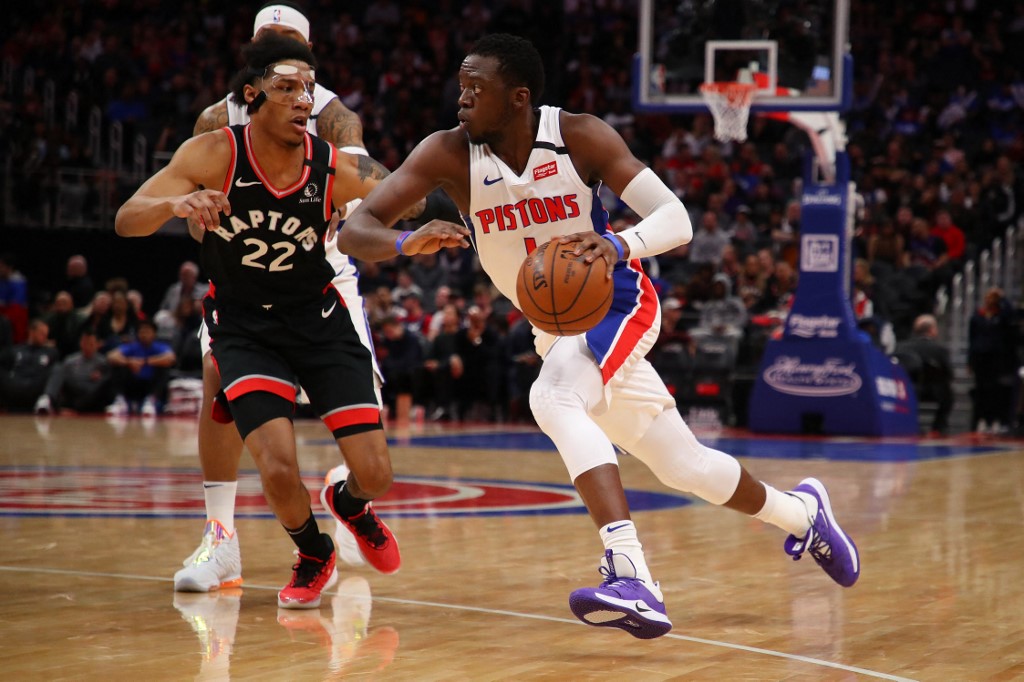 Reggie Jackson #1 of the Detroit Pistons drives around Patrick McCaw #22 of Toronto. Check out the Pistons vs Raptors betting preview