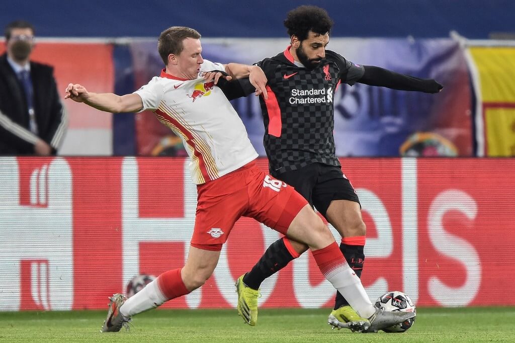 Leipzig's defender Lukas Klostermann and Liverpool's midfielder Mohamed Salah vie for the ball during UEFA Champions League