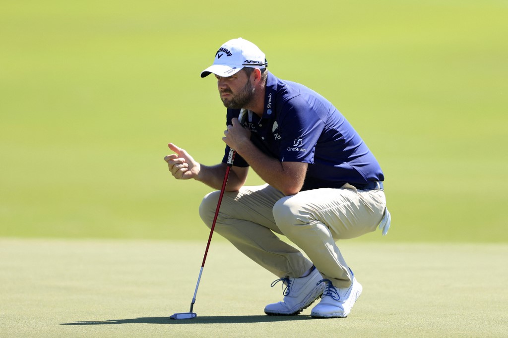 Marc Leishman of Australia lines up a putt on the fifth green during the first round of World Golf Championships-Workday Championship