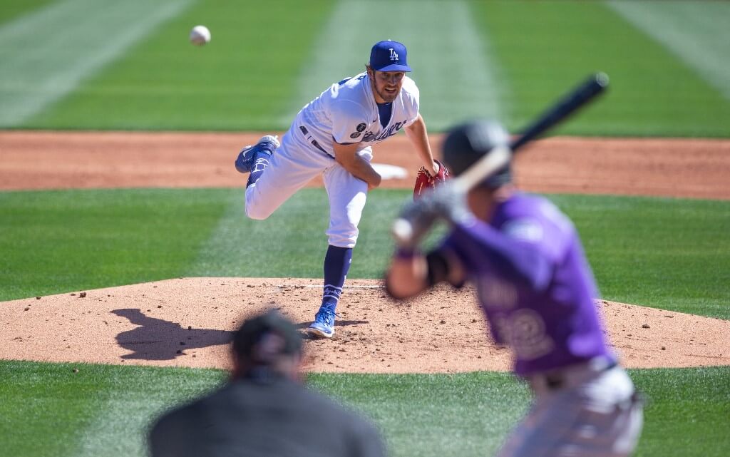 Trevor Bauer of the Los Angeles Dodgers pitches during a spring training game against the Colorado Rockies at Camelback Ranch