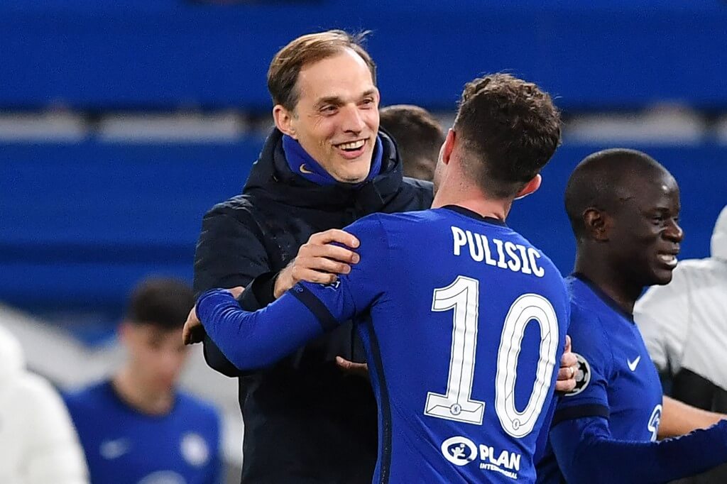 Chelsea's head coach Thomas Tuchel and Chelsea's US player Christian Pulisic react at the final whistle during a UCL match