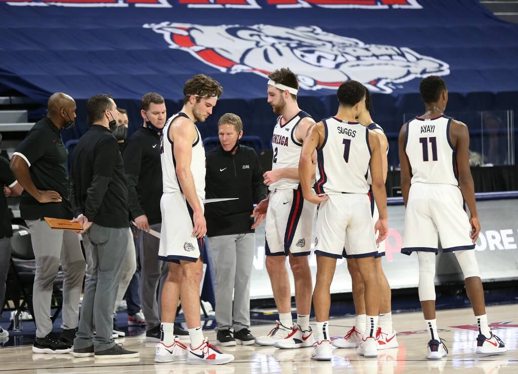 Head coach Mark Few of the Gonzaga Bulldogs huddles with his players during a timeout in the second half