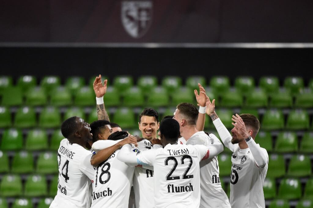 Lille's players celebrate after scoring a goal during the French L1 football match between Metz (FC Metz) and Lille (LOSC)