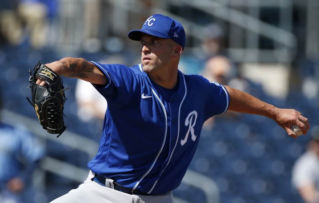 Starting pitcher Danny Duffy of the Royals throws against the Mariners during the MLB spring training baseball game