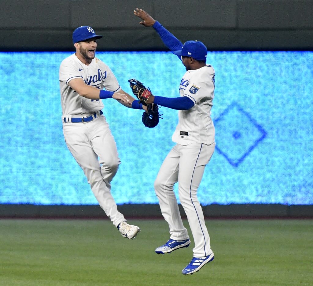 Andrew Benintendi and Jarrod Dyson of the Kansas City Royals celebrate a 2-0 win over the Milwaukee Brewers