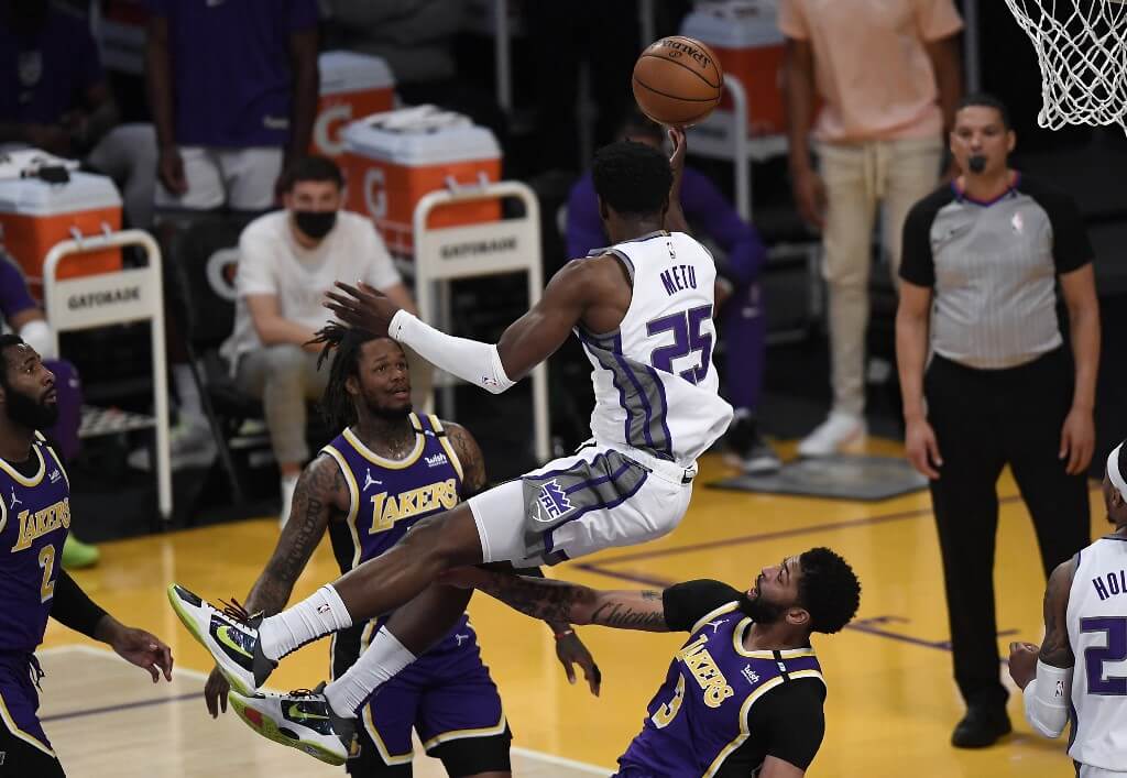 Chimezie Metu of the Sacramento Kings collides with Anthony Davis of the Los Angeles Lakers