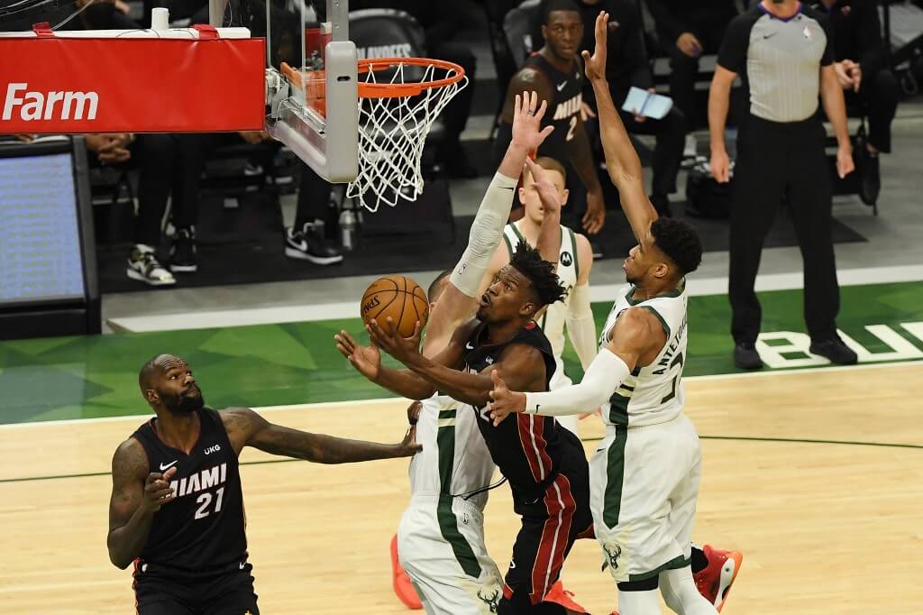 Jimmy Butler of the Miami Heat shoots in the first quarter against Giannis Antetokounmpo of the Milwaukee Bucks