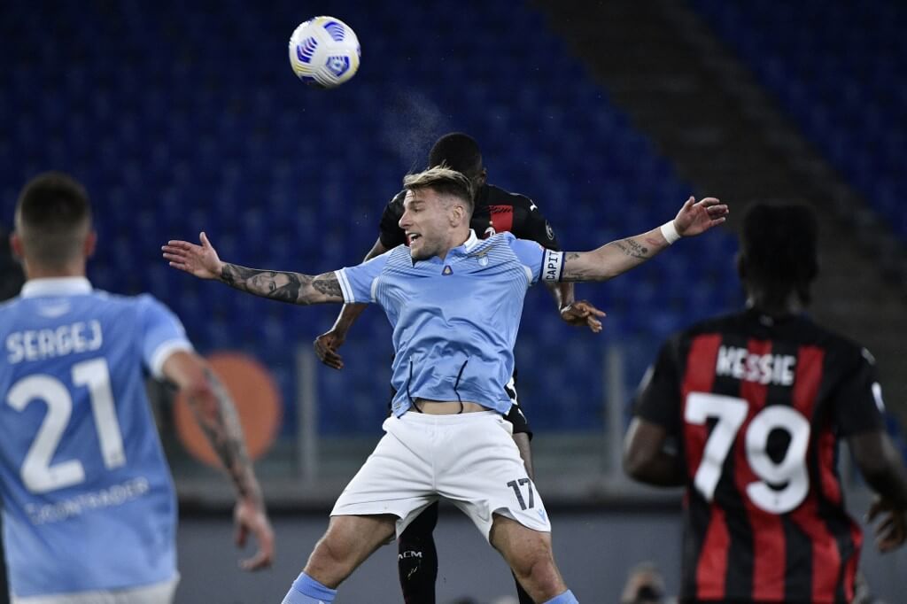 Lazio's Italian forward Ciro Immobile fights for the ball during the Italian Serie A football match between Lazio and Ac Milan