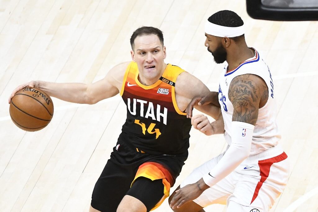 Bojan Bogdanovic of the Utah Jazz drives into Marcus Morris Sr. of the LA Clippers in Game One of the Western Conference
