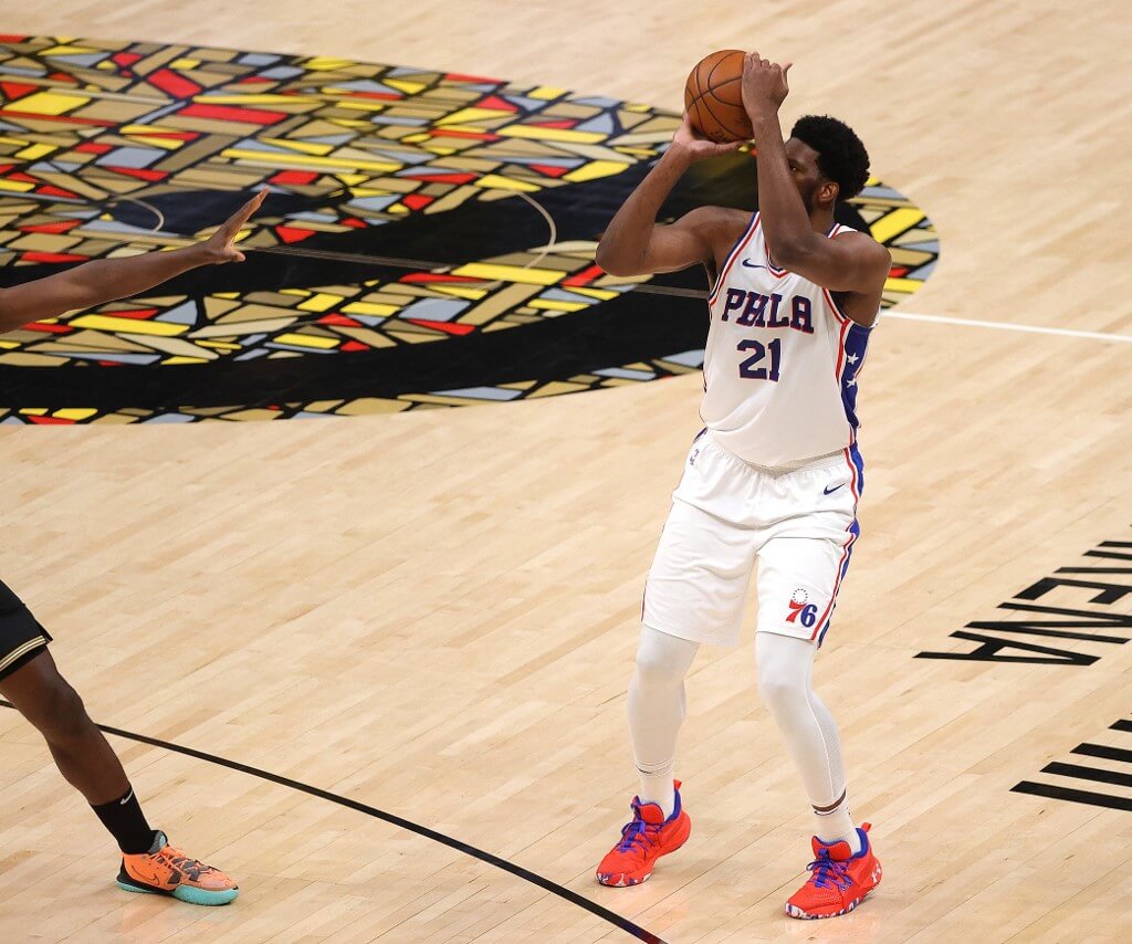 Joel Embiid of the Philadelphia 76ers shoots a three-point basket against the Atlanta Hawks