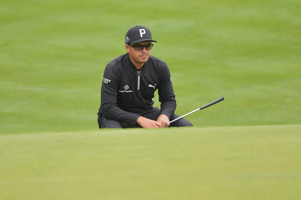 Rickie Fowler of the United States looks over a putt on the 15th green during the Travelers Championship