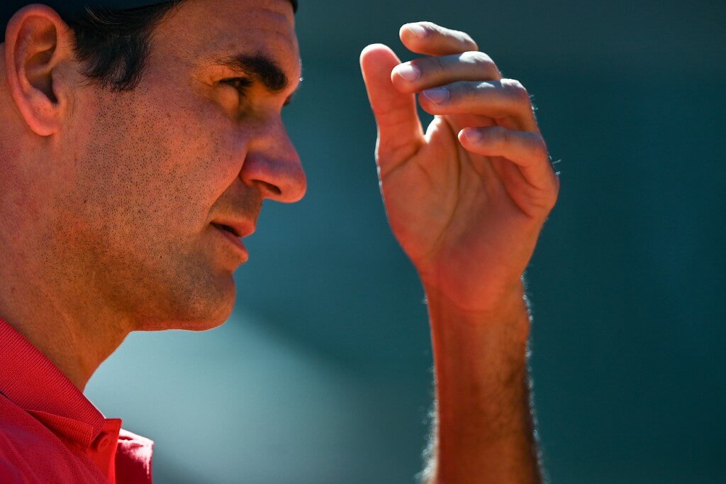 Roger Federer reacts during the men's singles first round tennis match against Denis Istomin in 2021 French Open