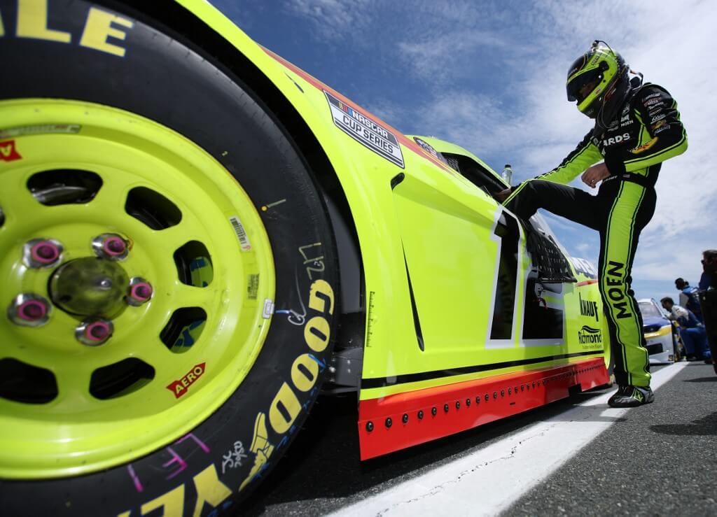 Ryan Blaney, driver of the Menards/Cardell Cabinetry Ford, gets into his car during the NASCAR Cup Series Drydene 400