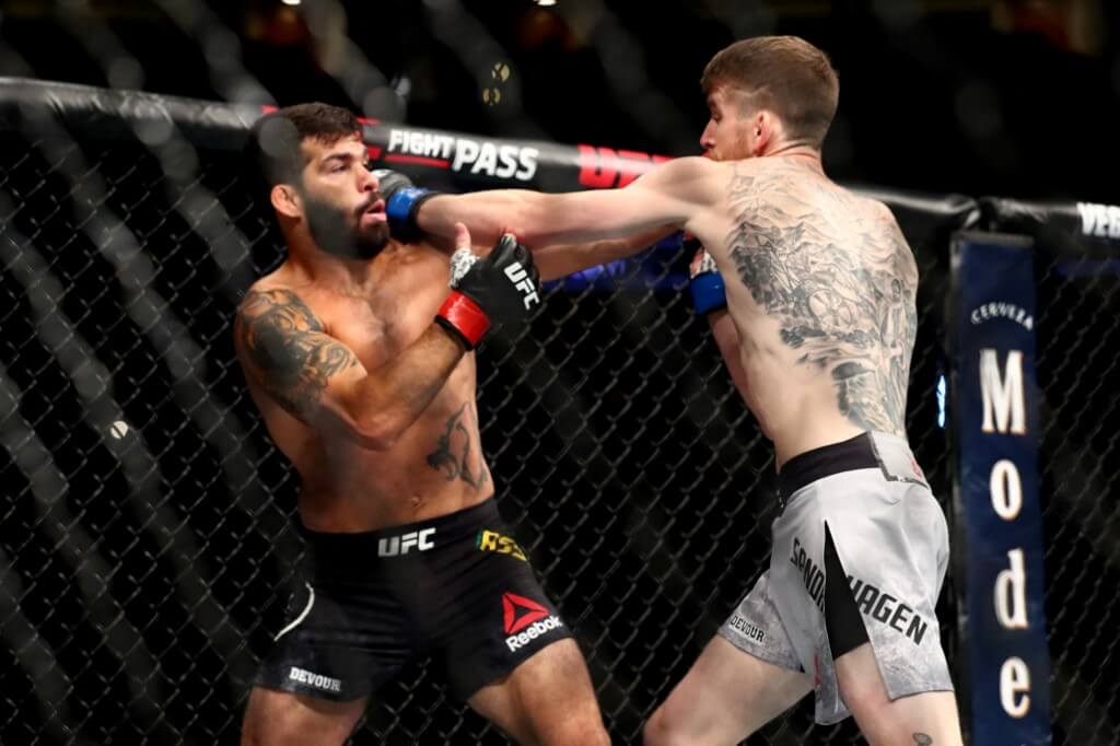Cory Sandhagen punches Raphael Assuncao in the first round during their Bantamweight Bout at UFC 241