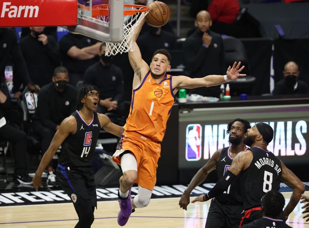 Devin Booker of the Phoenix Suns dunks against the LA Clippers