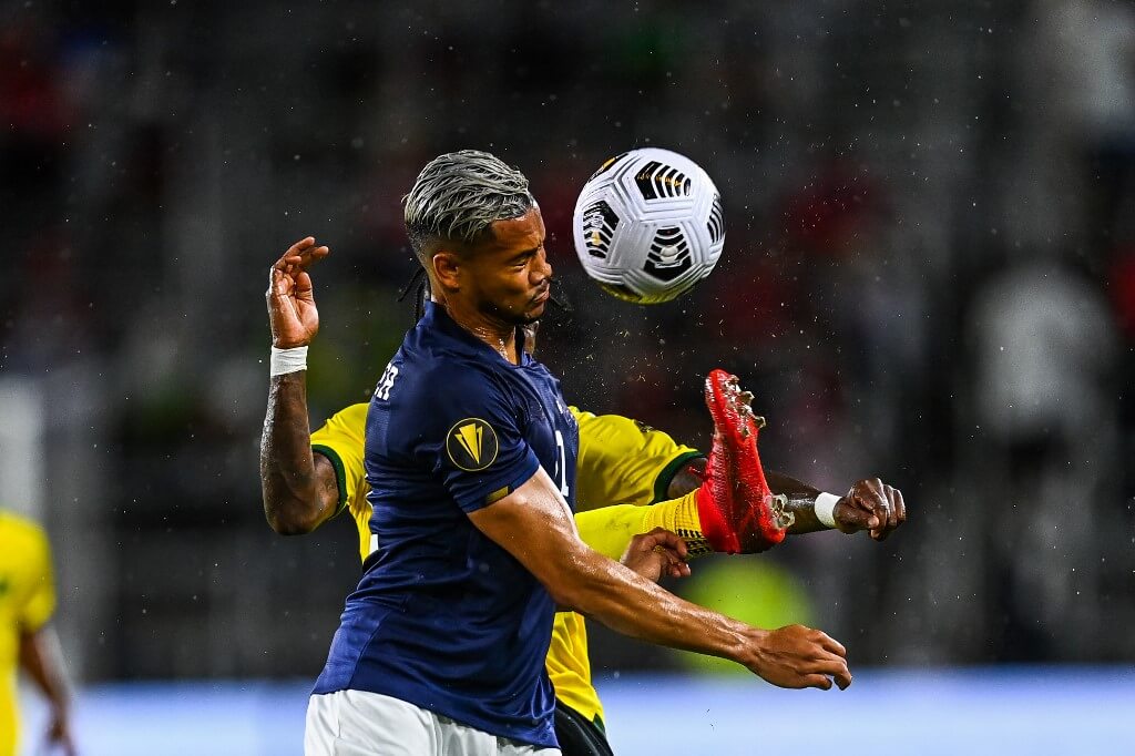 Oniel Fisher and Ariel Lassiter fight for the ball during the Concacaf Gold Cup football match between Costa Rica and Jamaica
