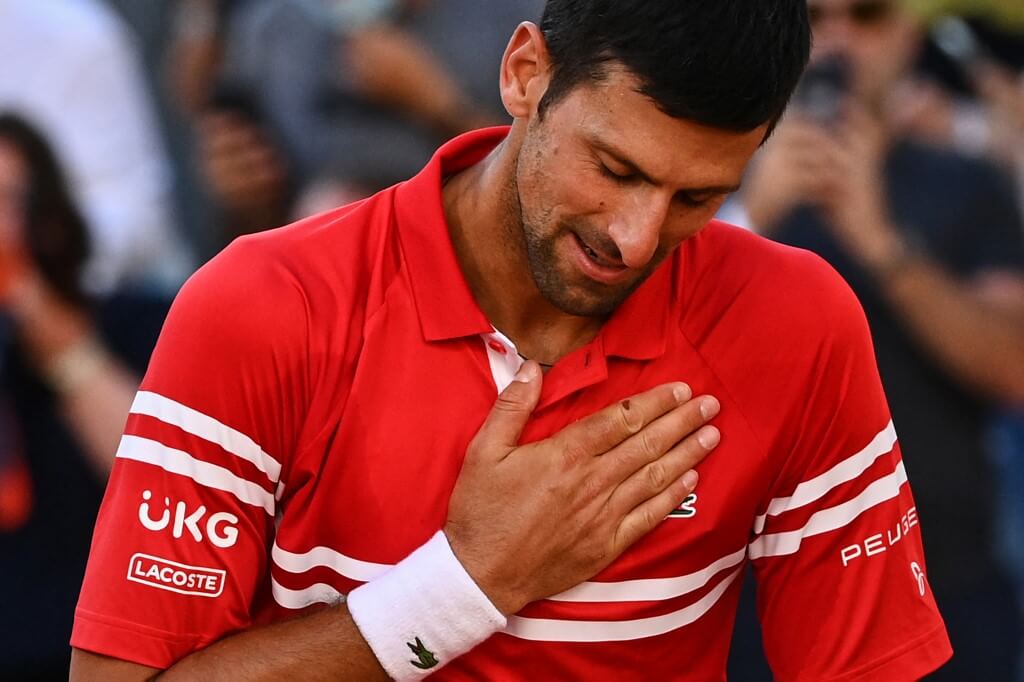 Serbia's Novak Djokovic celebrates after winning against Greece's Stefanos Tsitsipas at the end of their men's final