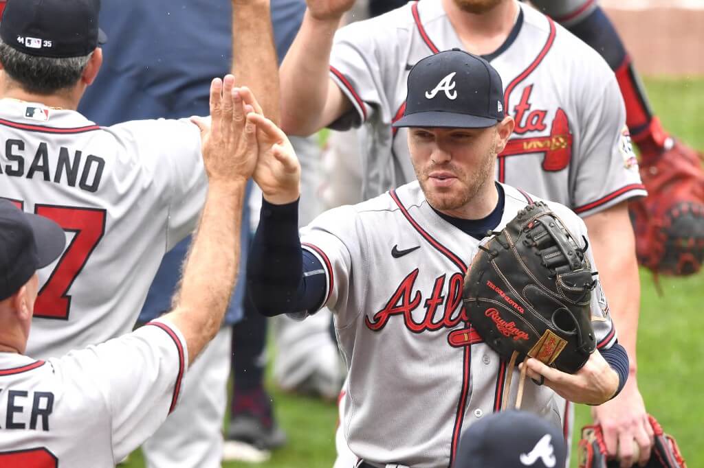 Freddie Freeman of the Atlanta Braves celebrates a win after a baseball game against the Baltimore Orioles