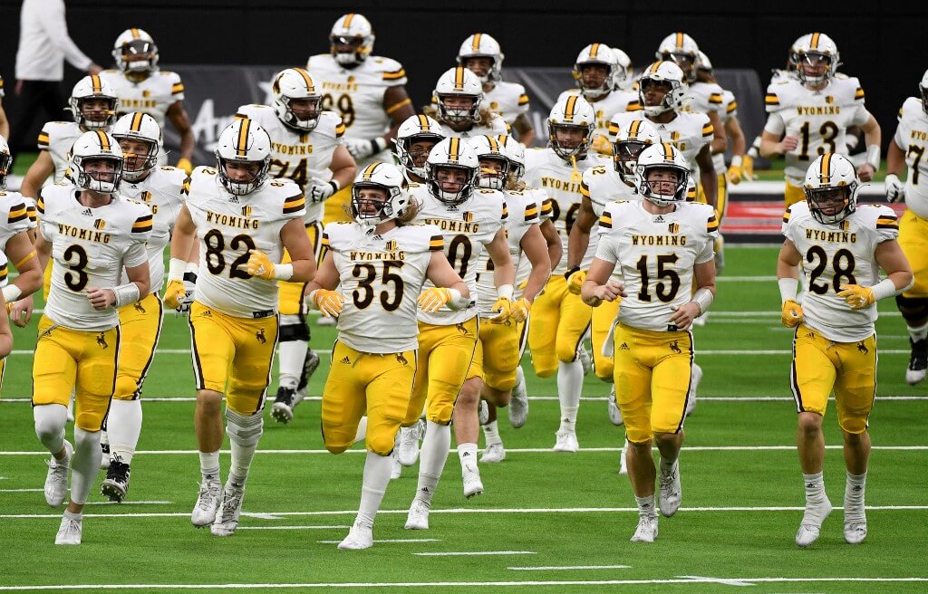 The Wyoming Cowboys take the field for their game against the UNLV Rebels at Allegiant Stadium