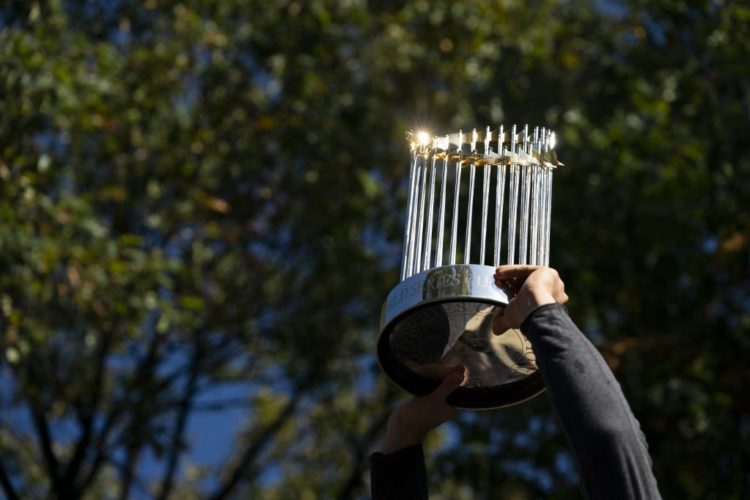 WASHINGTON, DC - NOVEMBER 02: Ryan Zimmerman #11 of the Washington Nationals holds up the Commissioner's Trophy during a parade to celebrate the Washington Nationals World Series victory over the Houston Astros on November 2, 2019 in Washington, DC. This is the first World Series win for the Nationals in 95 years.   Patrick McDermott/Getty Images/AFP (Photo by Patrick McDermott / GETTY IMAGES NORTH AMERICA / Getty Images via AFP)