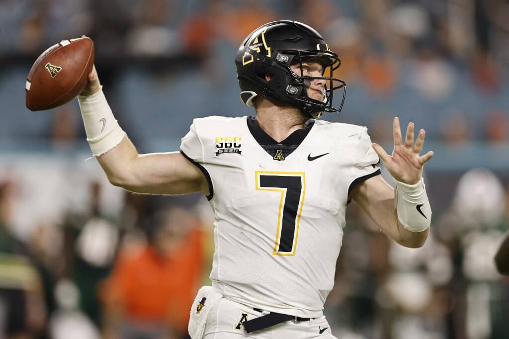 Chase Brice of the Appalachian State Mountaineers throws a pass against the Miami Hurricanes