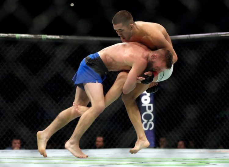 Tim Elliott battles Louis Smolka during thier Flyweight bout on UFC Fight Night