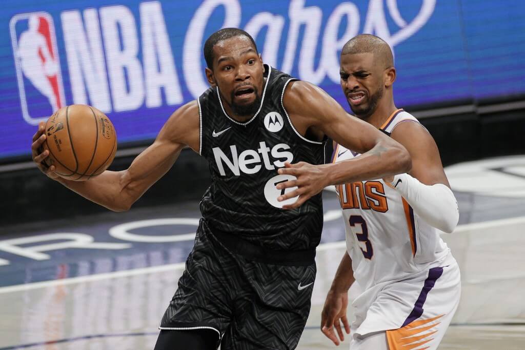 Kevin Durant drives past Chris Paul Phoenix Suns vs Brooklyn Nets Picks