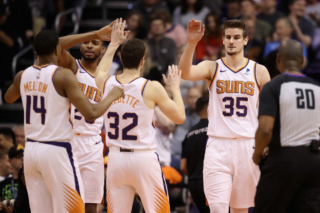 Dragan Bender #35 of the Phoenix Suns high fives De'Anthony Melton #14